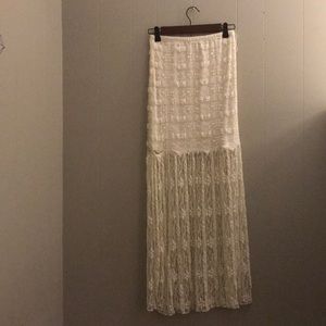 Light creamy white lace skirt.